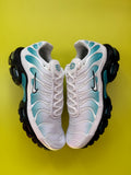 A pair of Nike Air Max Plus in white, light blue, and black.
